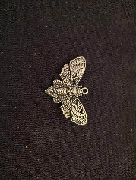 File:Mothman charm.jpg
